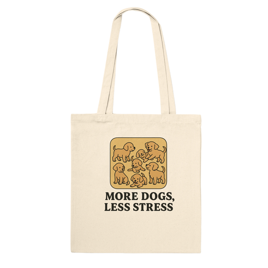 Beige tote bag with dog illustration and text 'More Dogs, Less Stress' 
